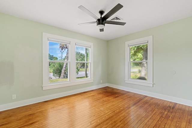 empty room with wood-type flooring and ceiling fan