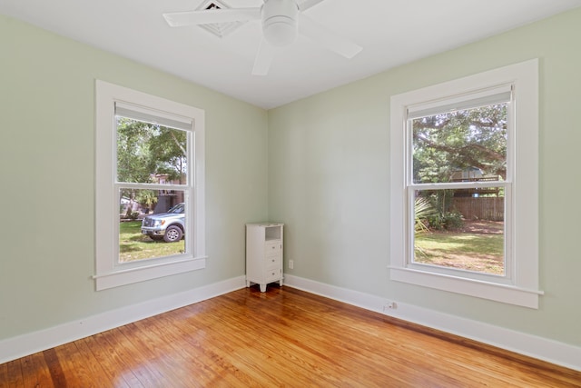 empty room featuring wood-type flooring and ceiling fan