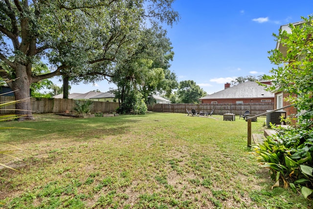 view of yard with central AC