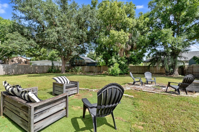 view of yard with a fire pit