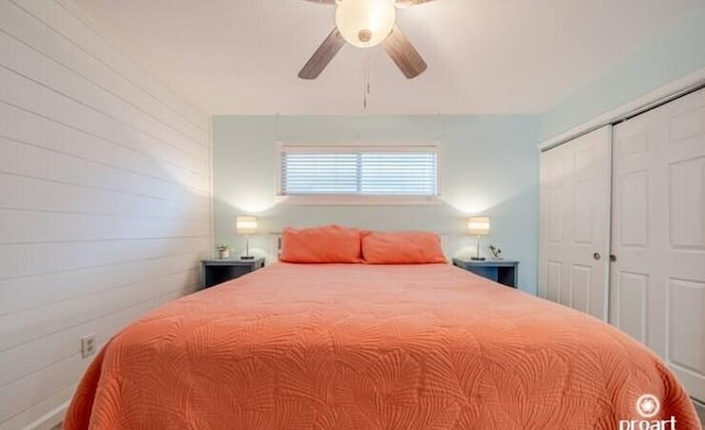 bedroom with ceiling fan and a closet