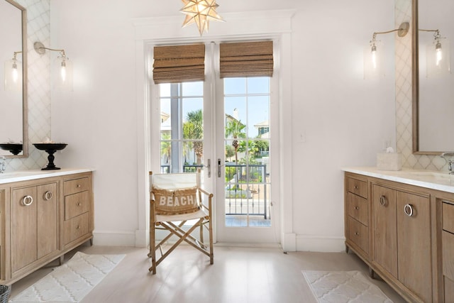 bathroom featuring tasteful backsplash, a wealth of natural light, and vanity