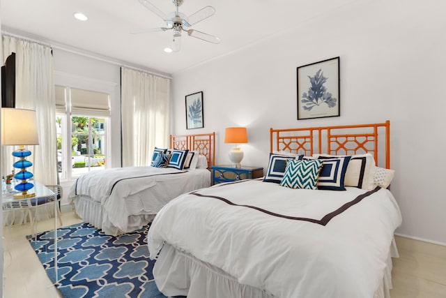 bedroom featuring ceiling fan and crown molding