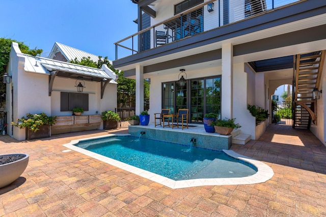 view of swimming pool with a patio area