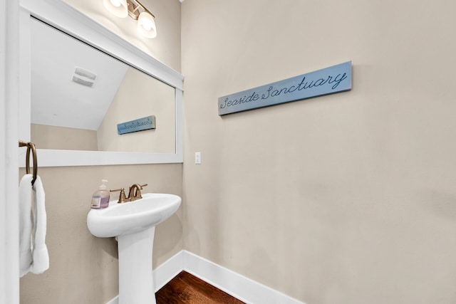 bathroom with wood-type flooring