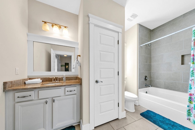 full bathroom featuring shower / bath combo, vanity, tile patterned floors, and toilet