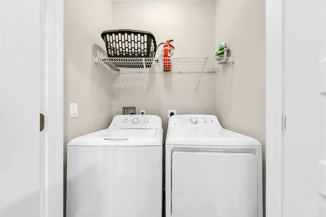 washroom with separate washer and dryer