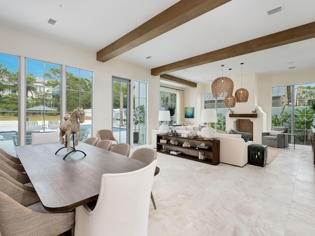 dining area with beam ceiling