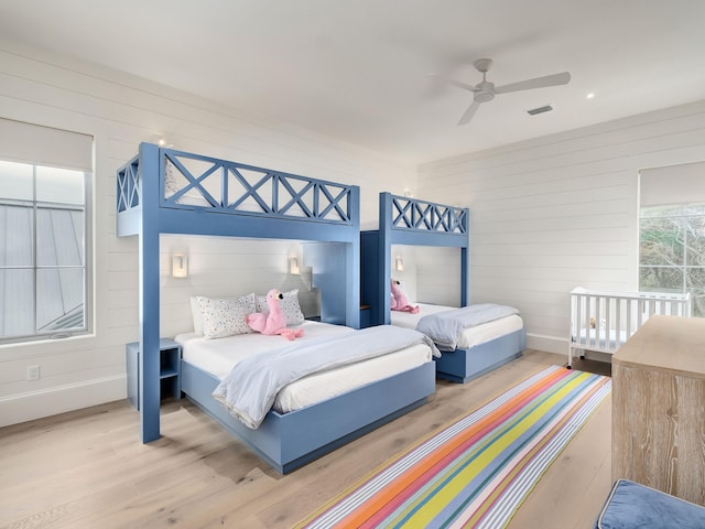 bedroom with ceiling fan and light wood-type flooring