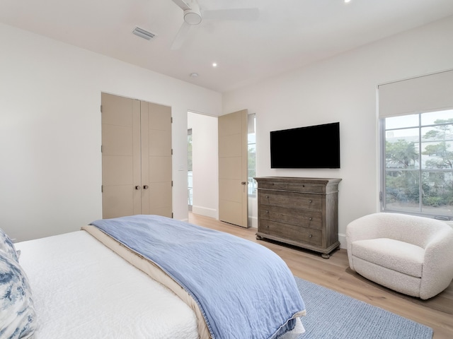 bedroom featuring light wood-type flooring and ceiling fan