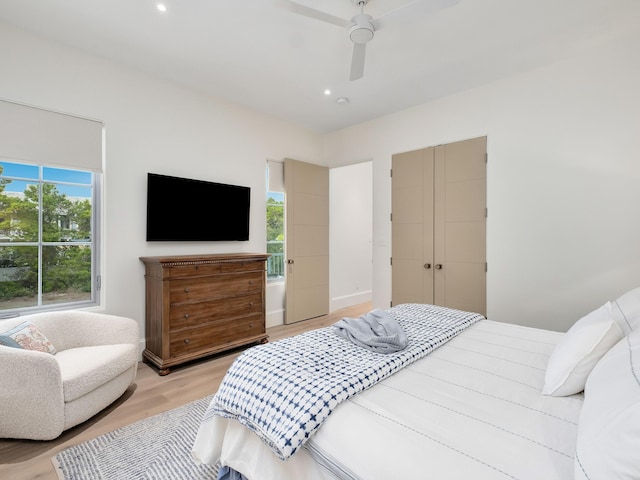 bedroom featuring ceiling fan and hardwood / wood-style floors