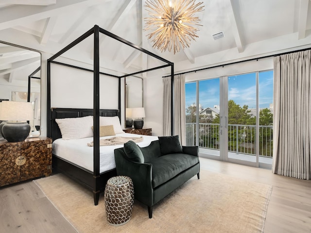 bedroom featuring beam ceiling, access to exterior, light hardwood / wood-style flooring, and an inviting chandelier