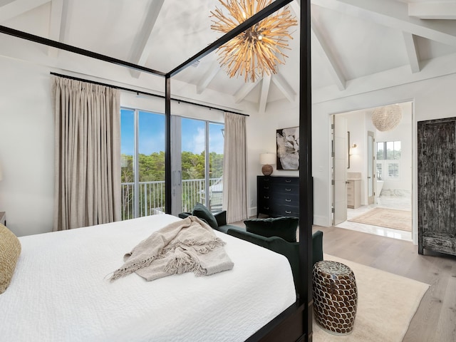 bedroom featuring connected bathroom, access to exterior, lofted ceiling with beams, a chandelier, and hardwood / wood-style flooring