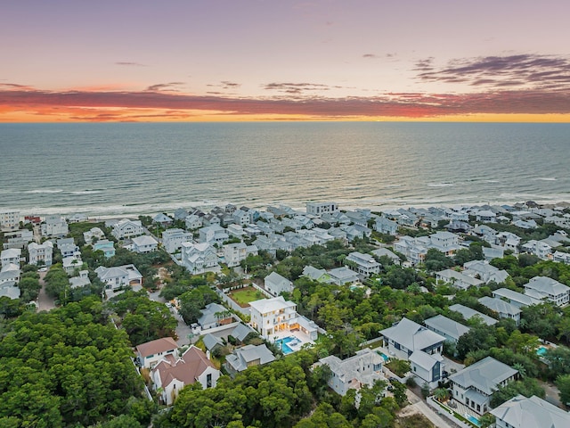 aerial view at dusk with a water view