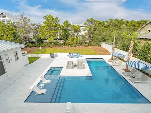 view of swimming pool featuring a yard and a patio