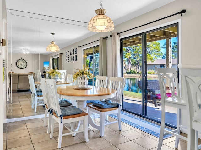 dining space featuring light tile patterned flooring