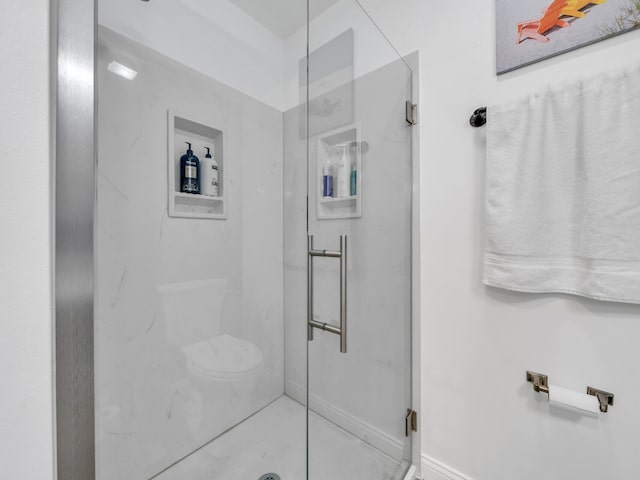 bathroom with tile patterned floors and a shower with door