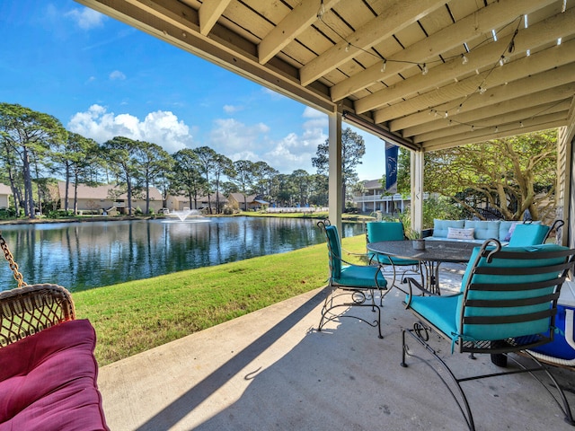 view of patio / terrace featuring outdoor lounge area and a water view