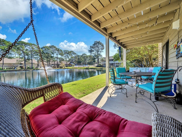 view of patio with a water view