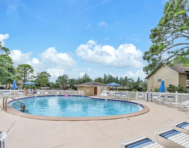 view of swimming pool with a patio area