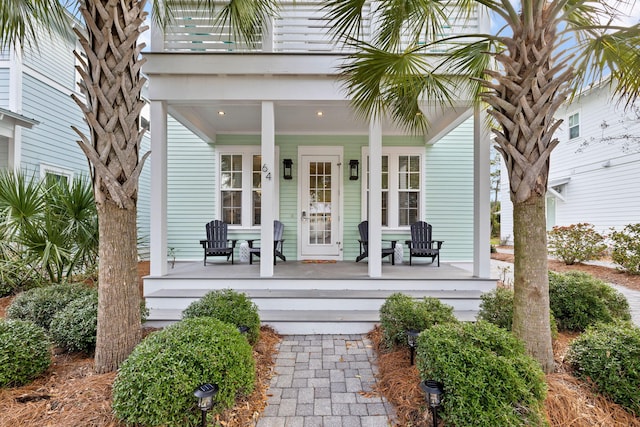 property entrance featuring covered porch