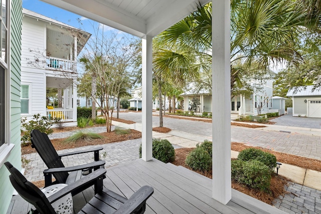 wooden terrace with a porch