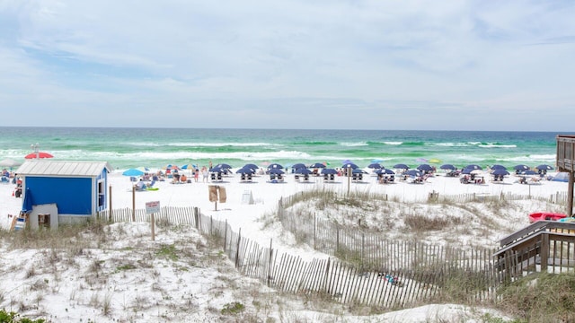 aerial view featuring a view of the beach and a water view