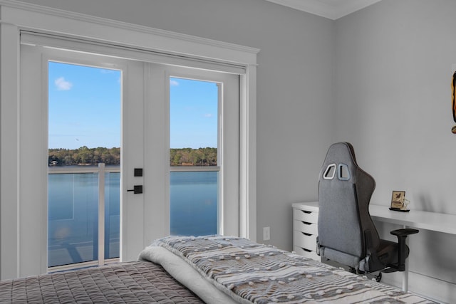 bedroom with multiple windows and crown molding