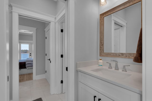 bathroom with baseboards and vanity