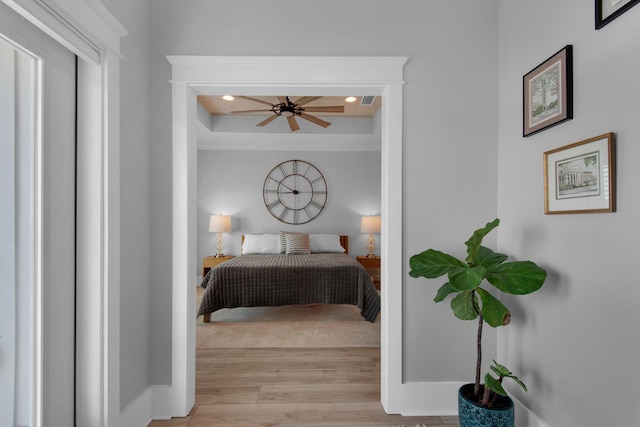 bedroom with recessed lighting, baseboards, and light wood finished floors