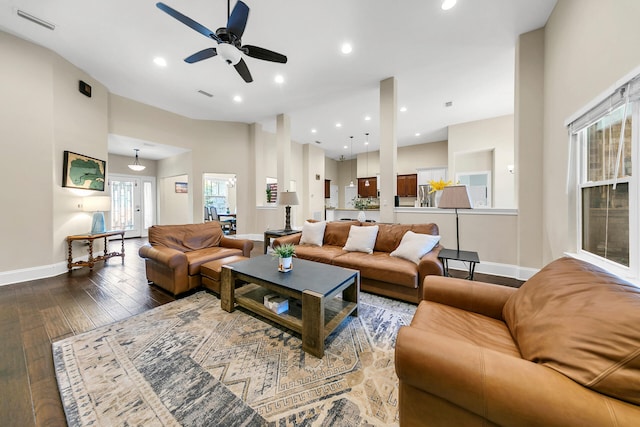 living room with wood-type flooring and ceiling fan