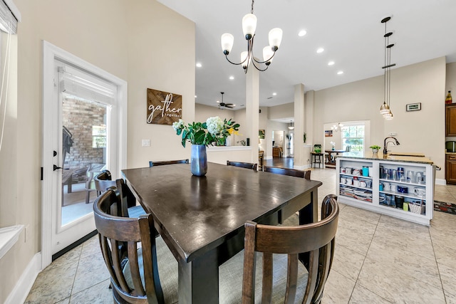 tiled dining space featuring an inviting chandelier