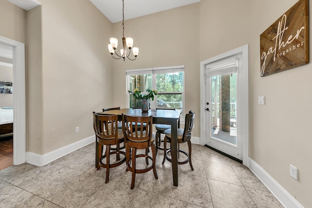 dining space with a notable chandelier