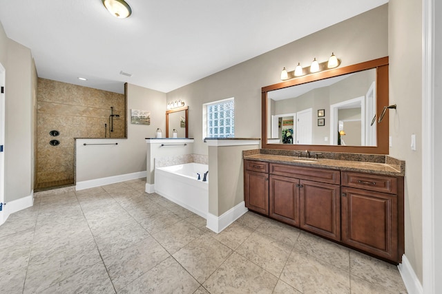 bathroom featuring tile patterned flooring, vanity, and separate shower and tub