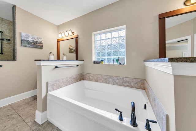 bathroom with a tub to relax in