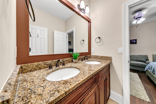 bathroom featuring vanity and wood-type flooring