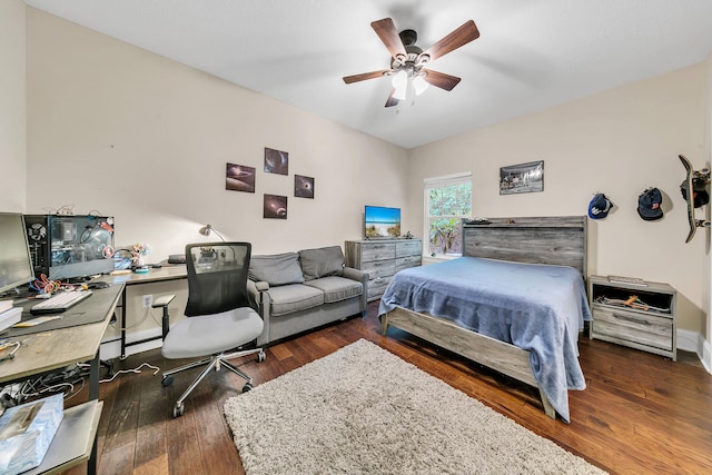 bedroom with ceiling fan and dark wood-type flooring