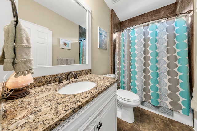 bathroom featuring vanity, a shower with shower curtain, and toilet