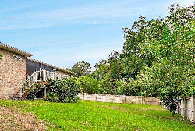 view of yard featuring a wooden deck