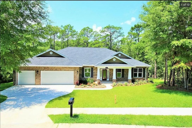 view of front of home with a garage and a front yard