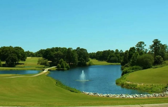 surrounding community featuring a water view