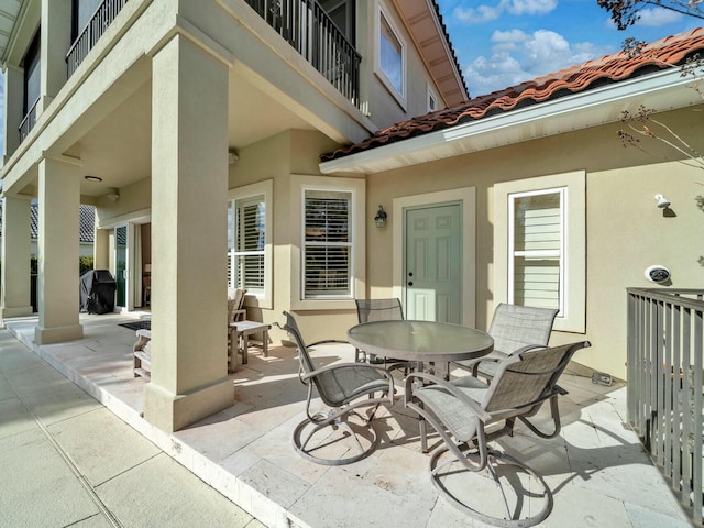 view of patio / terrace with a balcony