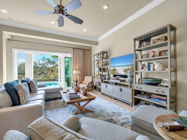 living room with ceiling fan and crown molding