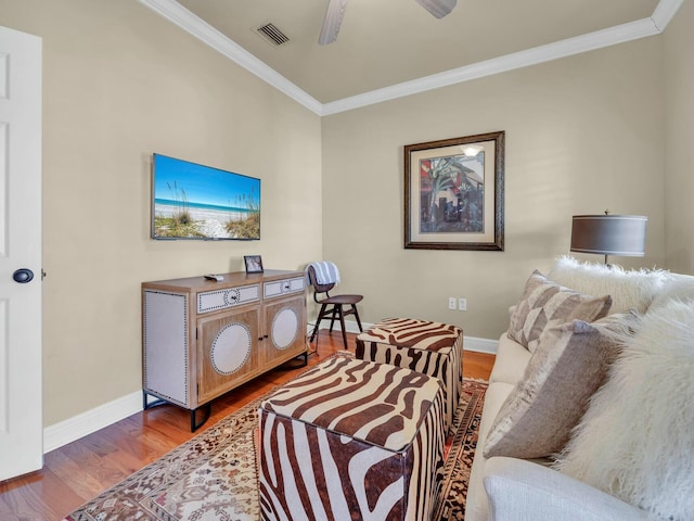 living room featuring ceiling fan, crown molding, and hardwood / wood-style floors