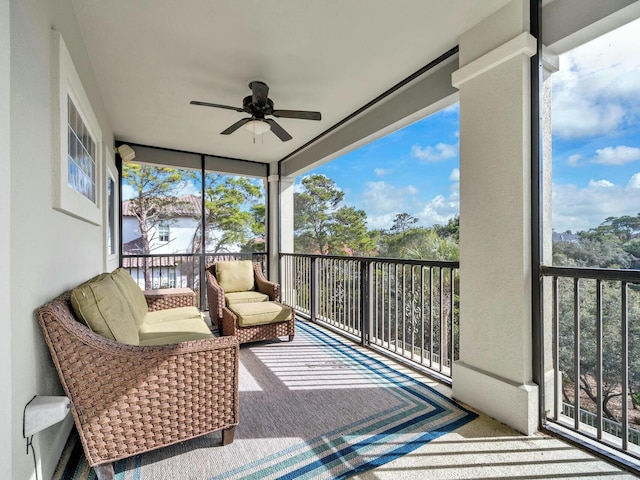 sunroom featuring ceiling fan