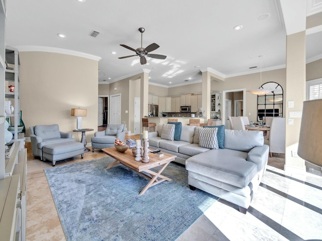 living room featuring ceiling fan, light tile patterned floors, and ornamental molding