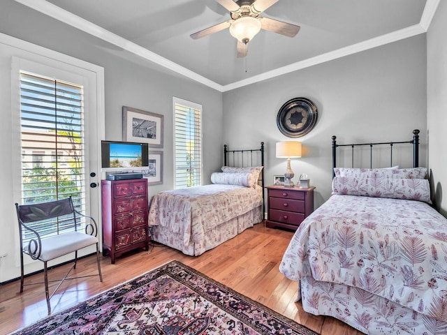 bedroom with ceiling fan, light hardwood / wood-style floors, access to exterior, and crown molding