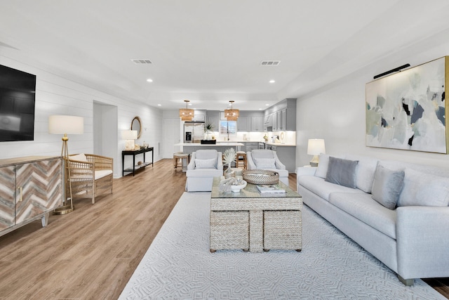 living room with light hardwood / wood-style floors