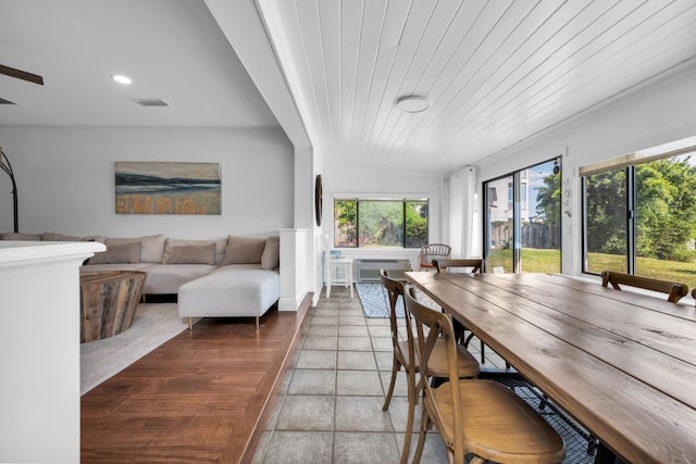 tiled dining room with wooden ceiling