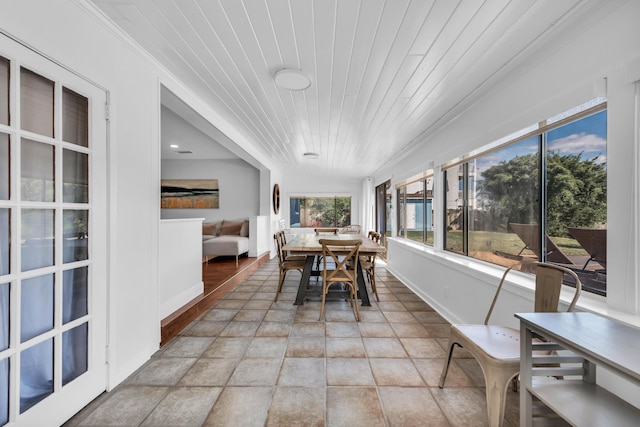 sunroom featuring wood ceiling